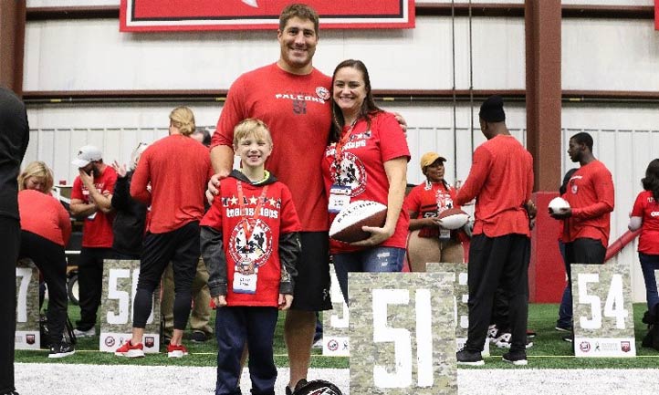 TAPS mom and son with Falcons Football player Alex Mack