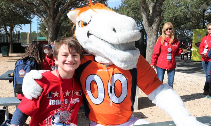 TAPS boy with mascot at 2019 NFL Pro Bowl