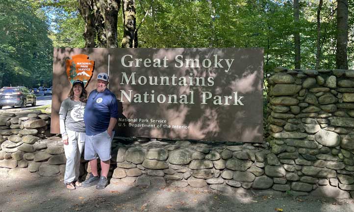 TAPS Survivors next to Great Smoky Mountains sign