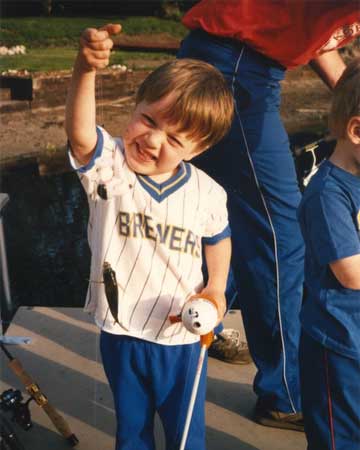 Nate as little boy at baseball game