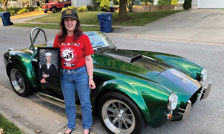 Julie El-Taher next to Ford Shelby GT