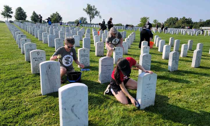 Survivors at Carry the Load Patriot Day cleaning headstones